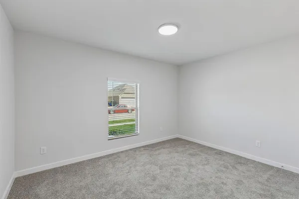 a bathroom with a shower sink and mirror