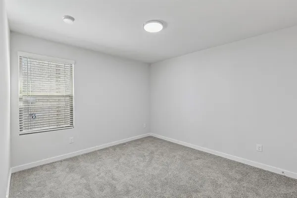 a bathroom with a double vanity sink and mirror