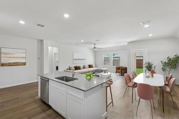 a view of a house with a yard and a garden