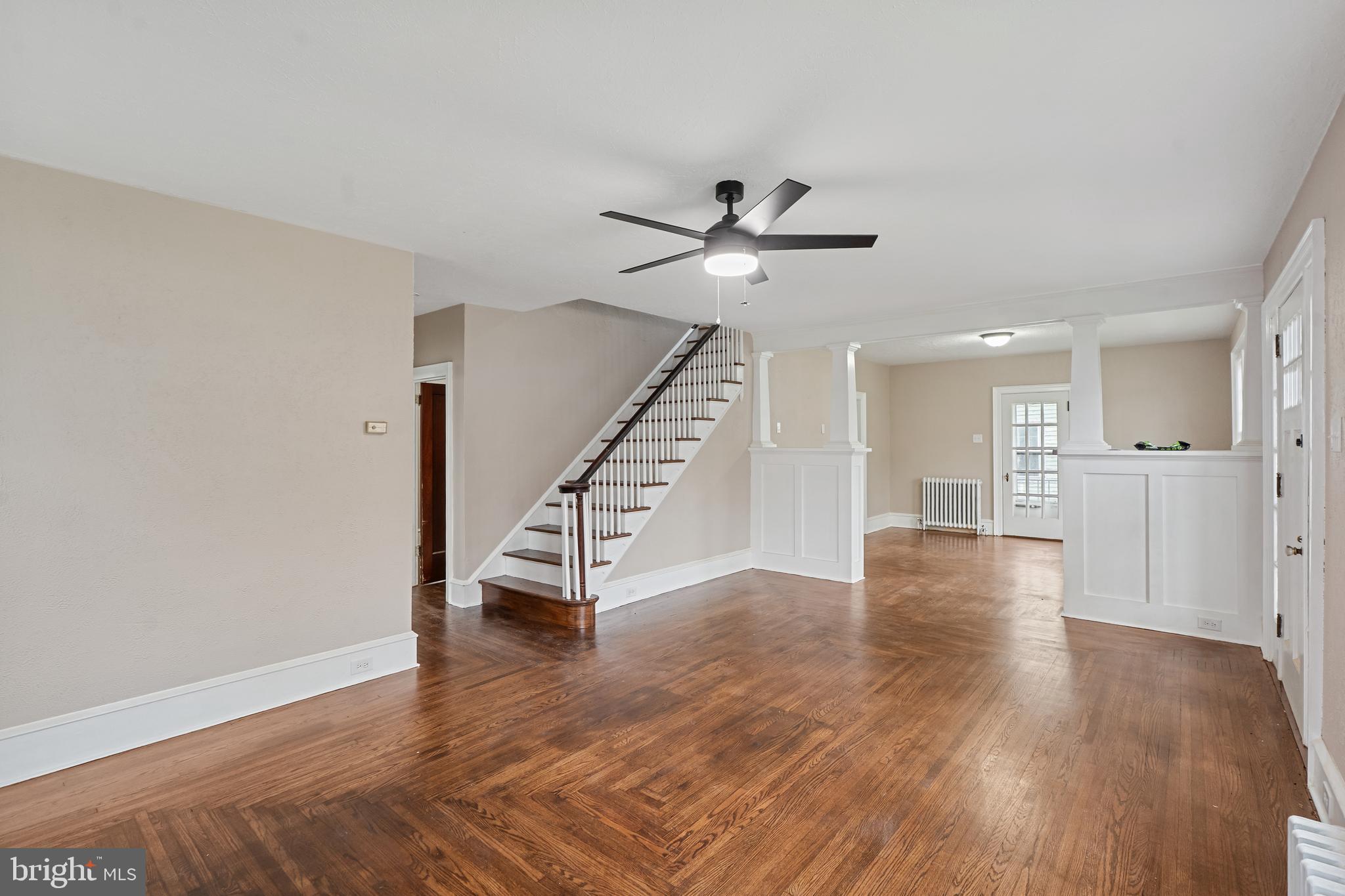 414 Main Street Dorchester, NJ 08316 - Photo 4 of 22 a view of an empty room with wooden floor and a ceiling fan