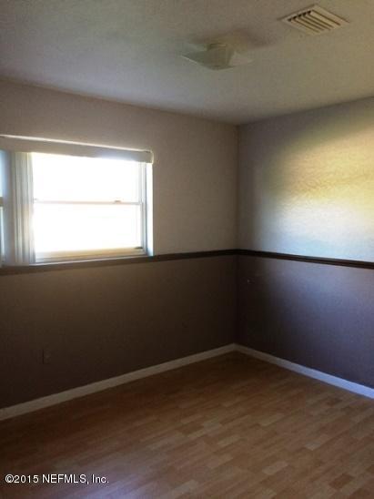 6520 Diane Road Jacksonville, FL 32277 - Photo 12 of 16 an empty room with a window