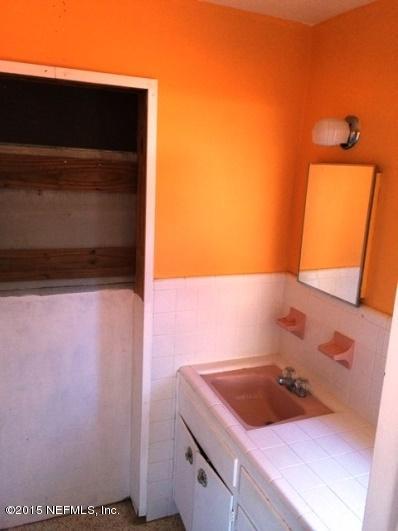 6520 Diane Road Jacksonville, FL 32277 - Photo 8 of 16 a bathroom with a sink and a mirror