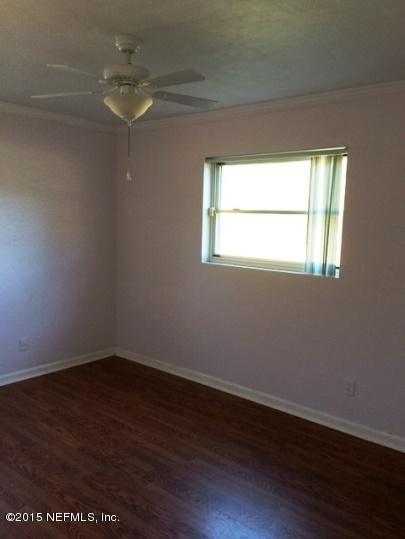 6520 Diane Road Jacksonville, FL 32277 - Photo 10 of 16 a view of a room that has wooden floor and a window