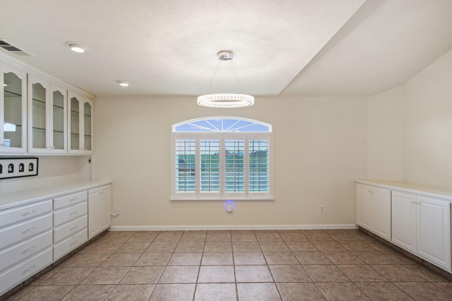 845 Pointe Lourose Avenue Gustine, CA 95322 - Photo 14 of 34 a view of an empty room with a window