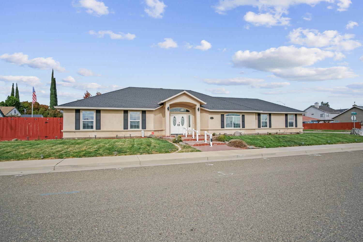 845 Pointe Lourose Avenue Gustine, CA 95322 - Photo 2 of 34 a front view of house with yard and green space