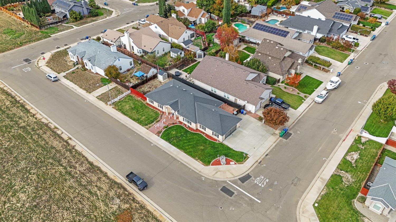 845 Pointe Lourose Avenue Gustine, CA 95322 - Photo 32 of 34 an aerial view of a house with a yard and garden