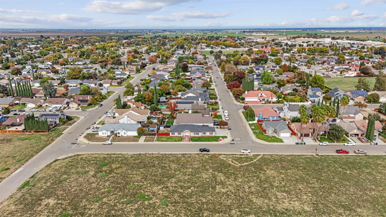 845 Pointe Lourose Avenue Gustine, CA 95322 - Photo 34 of 34 an aerial view of residential building and car parked