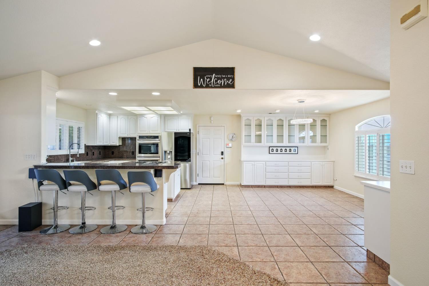 845 Pointe Lourose Avenue Gustine, CA 95322 - Photo 9 of 34 a view of kitchen with furniture and refrigerator