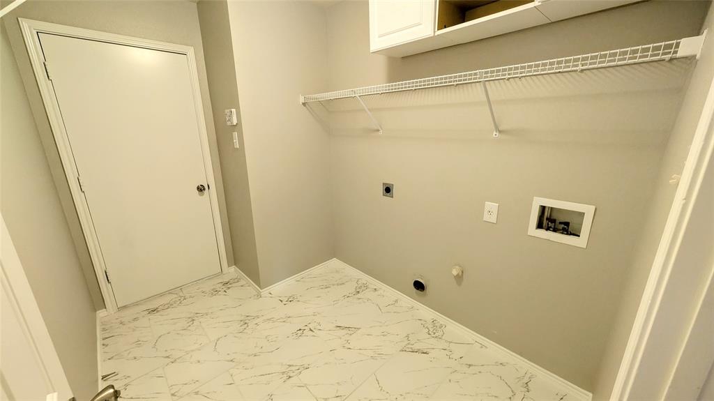 1308 Lamar Lane Allen, TX 75002 - Photo 11 of 40 Laundry room featuring marble finish flooring, hookup for a washing machine, electric dryer hookup, cabinet space, and gas dryer hookup