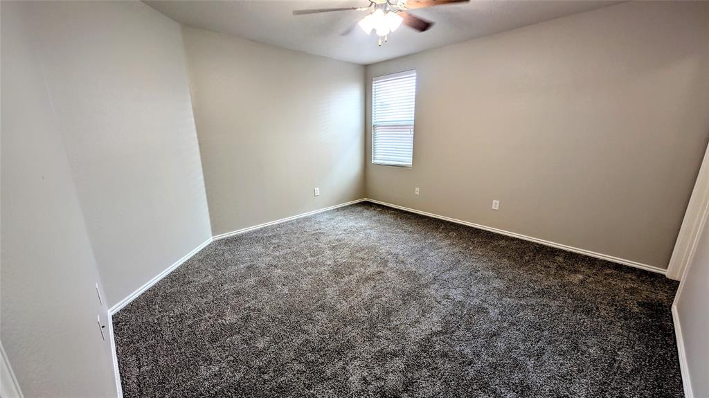 1308 Lamar Lane Allen, TX 75002 - Photo 13 of 40 Spare room featuring carpet and ceiling fan