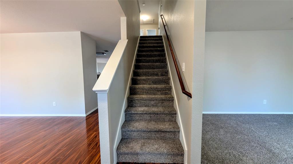 1308 Lamar Lane Allen, TX 75002 - Photo 16 of 40 Stairs with baseboards and wood finished floors