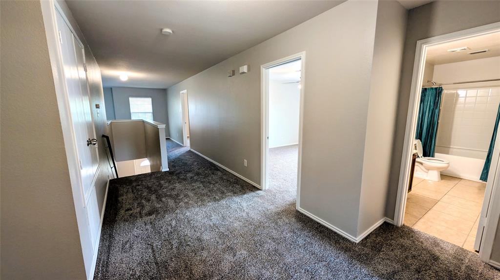 1308 Lamar Lane Allen, TX 75002 - Photo 18 of 40 Corridor featuring carpet flooring and an upstairs landing
