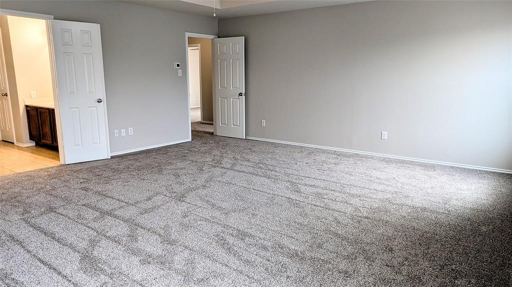 1308 Lamar Lane Allen, TX 75002 - Photo 21 of 40 Unfurnished bedroom with light colored carpet and ensuite bathroom