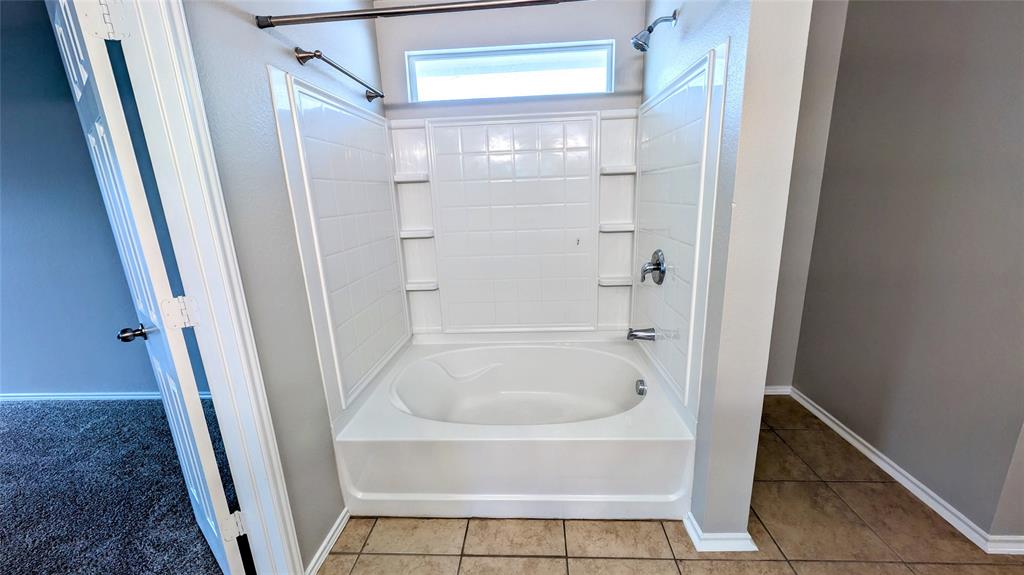 1308 Lamar Lane Allen, TX 75002 - Photo 22 of 40 Full bathroom featuring tub / shower combination and tile patterned floors