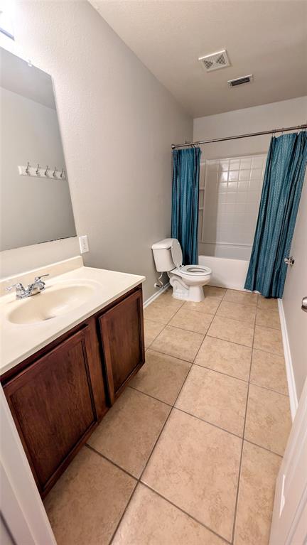 1308 Lamar Lane Allen, TX 75002 - Photo 29 of 40 Bathroom with vanity, shower / bath combination with curtain, and tile patterned flooring
