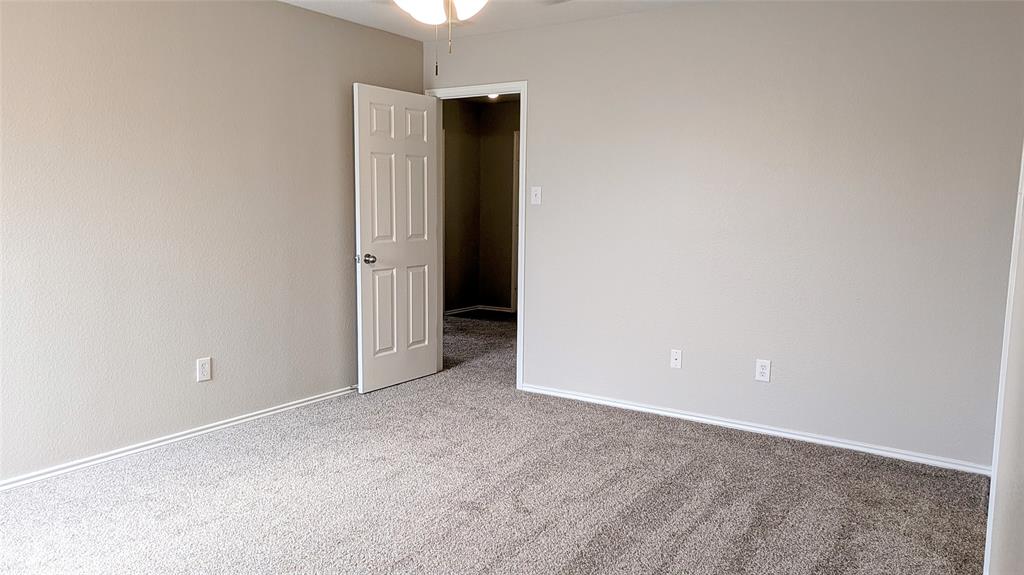1308 Lamar Lane Allen, TX 75002 - Photo 31 of 40 Empty room featuring carpet and a ceiling fan