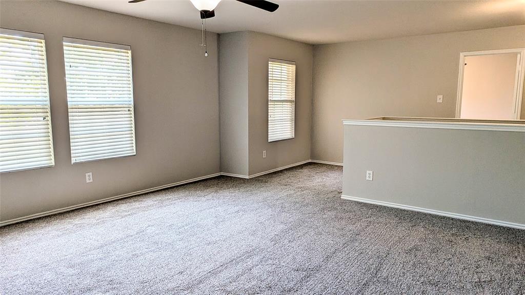 1308 Lamar Lane Allen, TX 75002 - Photo 34 of 40 Carpeted spare room with a ceiling fan and baseboards