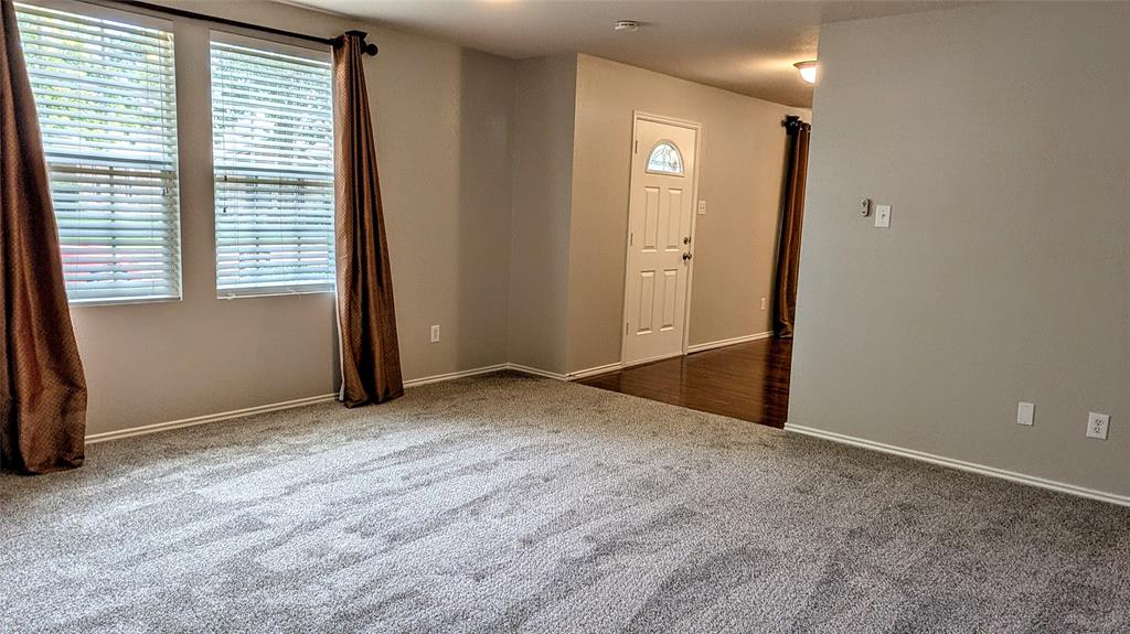 1308 Lamar Lane Allen, TX 75002 - Photo 5 of 40 Carpeted empty room featuring baseboards