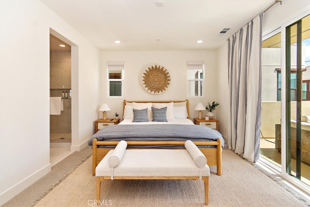 1030 Harbor Boulevard Oxnard, CA 93035 - Photo 24 of 40 a living room with a bed furniture and a large window