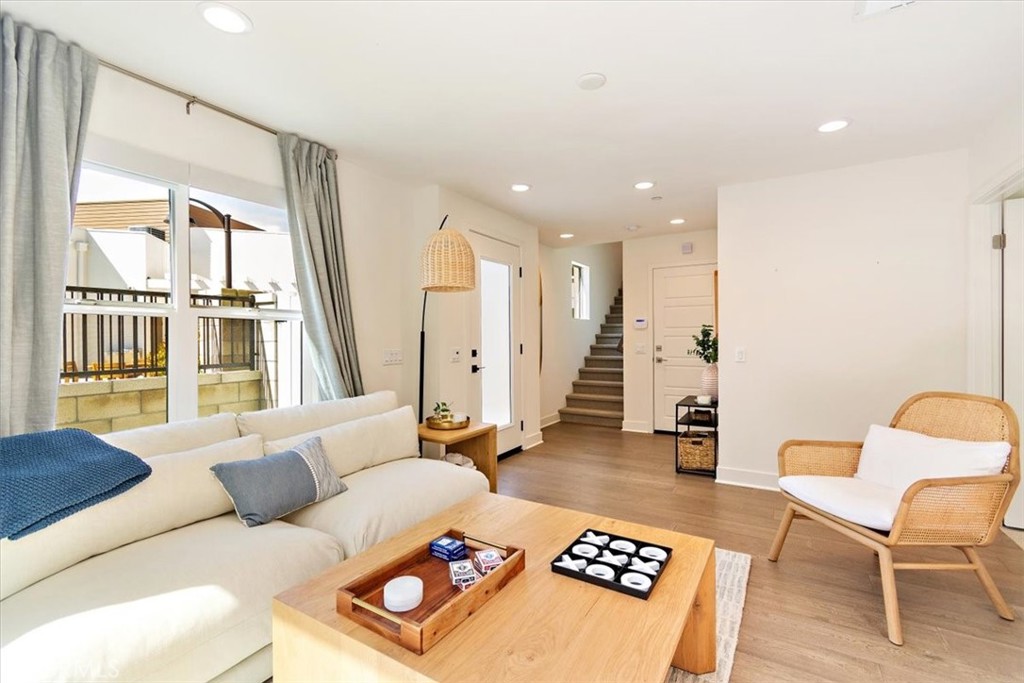 1030 Harbor Boulevard Oxnard, CA 93035 - Photo 5 of 40 a living room with furniture and a large window