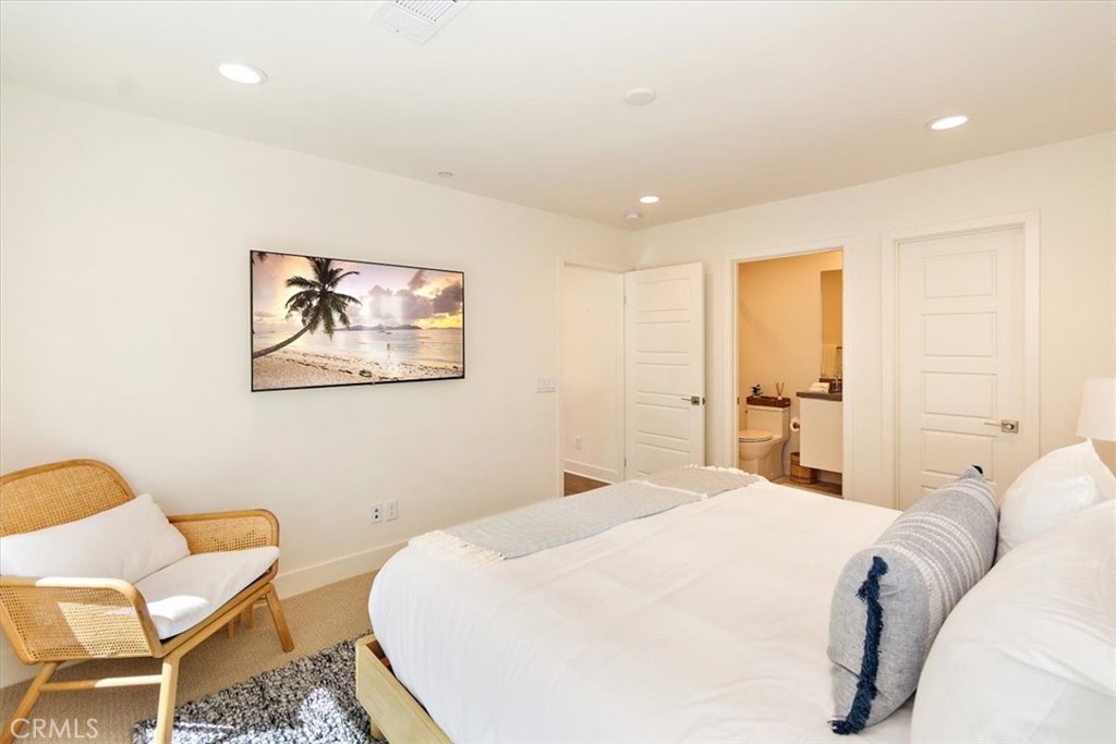 1030 Harbor Boulevard Oxnard, CA 93035 - Photo 7 of 40 a spacious bedroom with a bed and chair