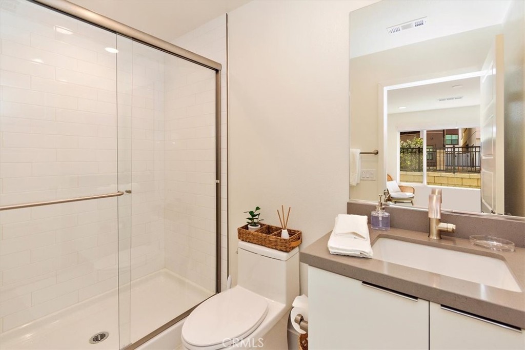 1030 Harbor Boulevard Oxnard, CA 93035 - Photo 8 of 40 a bathroom with a sink a toilet and shower