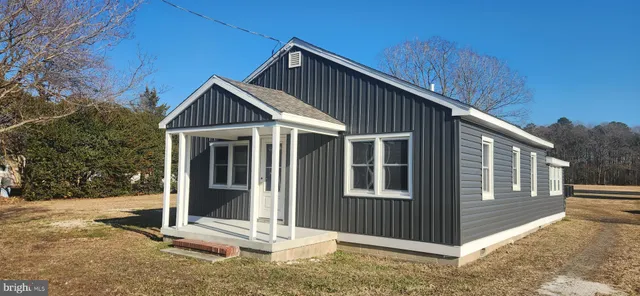 a front view of a house with a porch