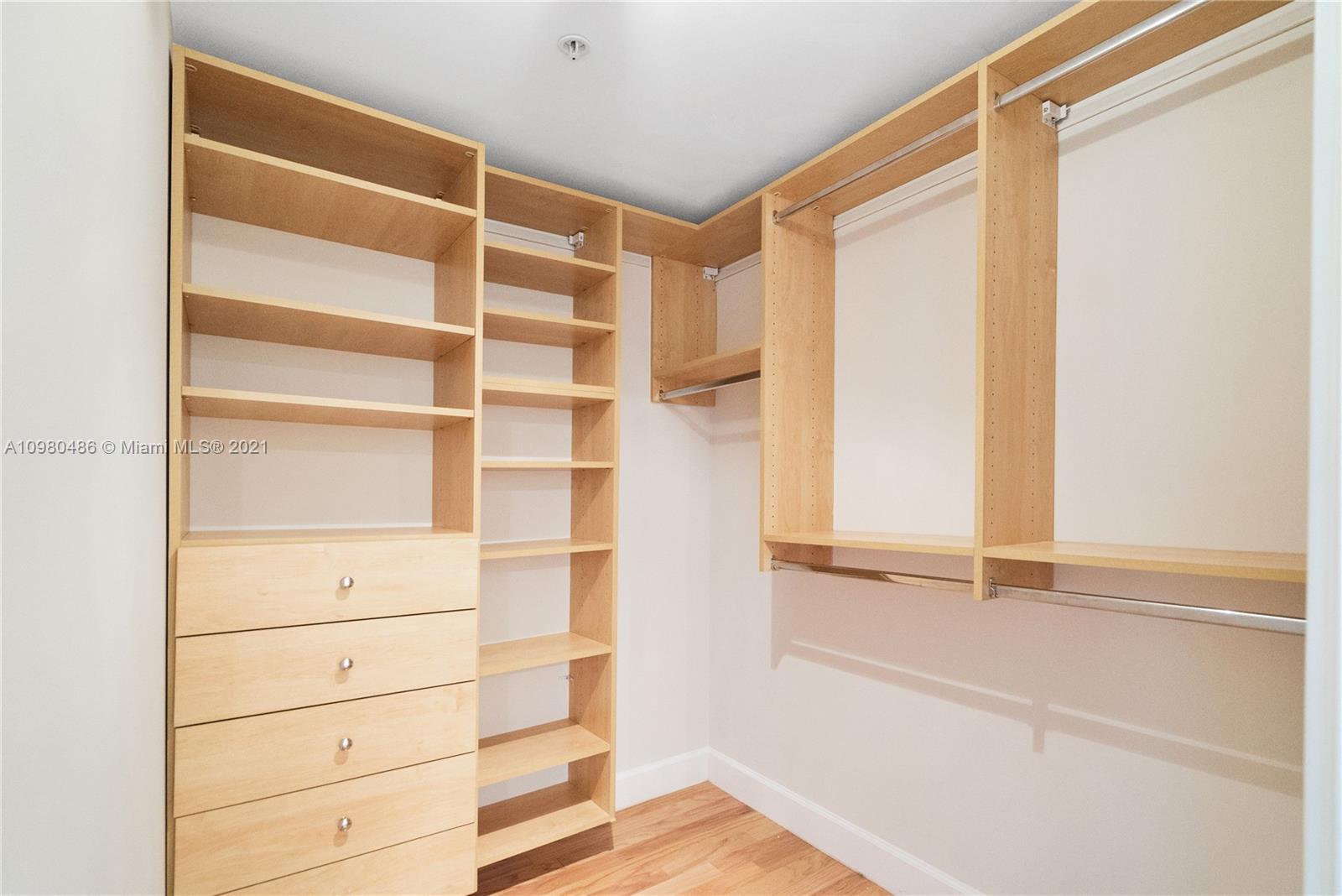 3540 Main Highway, Unit 309 Miami, FL 33133 - Photo 16 of 34 a view of walk in closet with empty racks