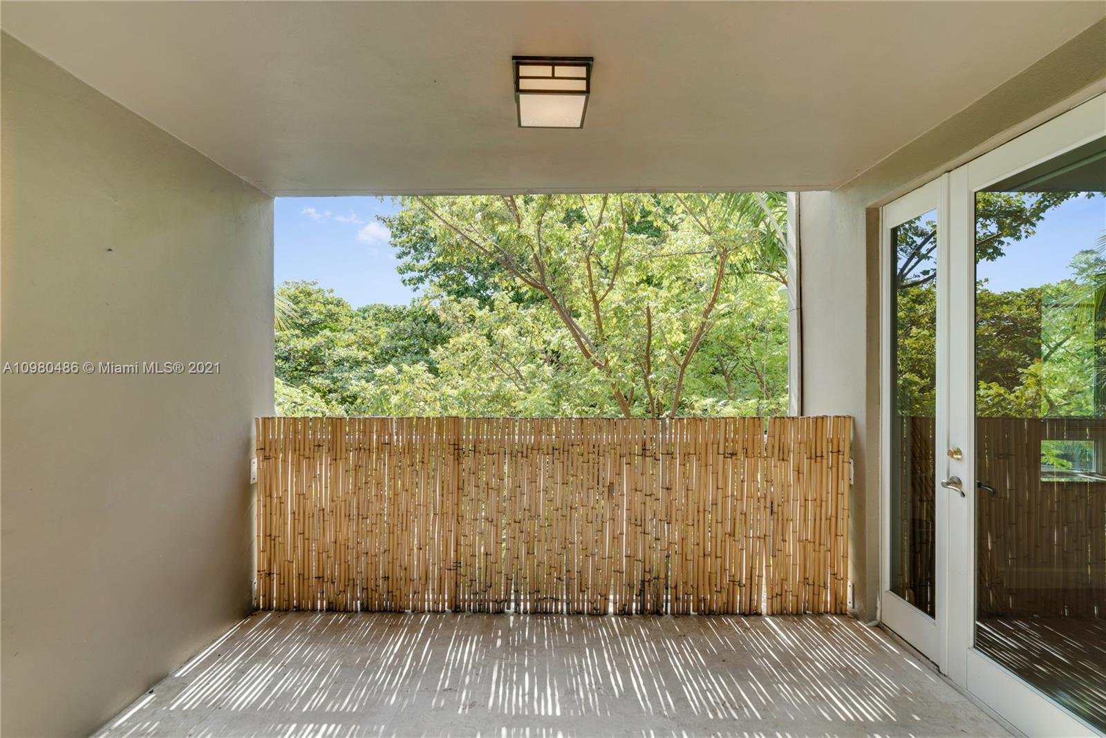 3540 Main Highway, Unit 309 Miami, FL 33133 - Photo 27 of 34 a view of a house with a balcony