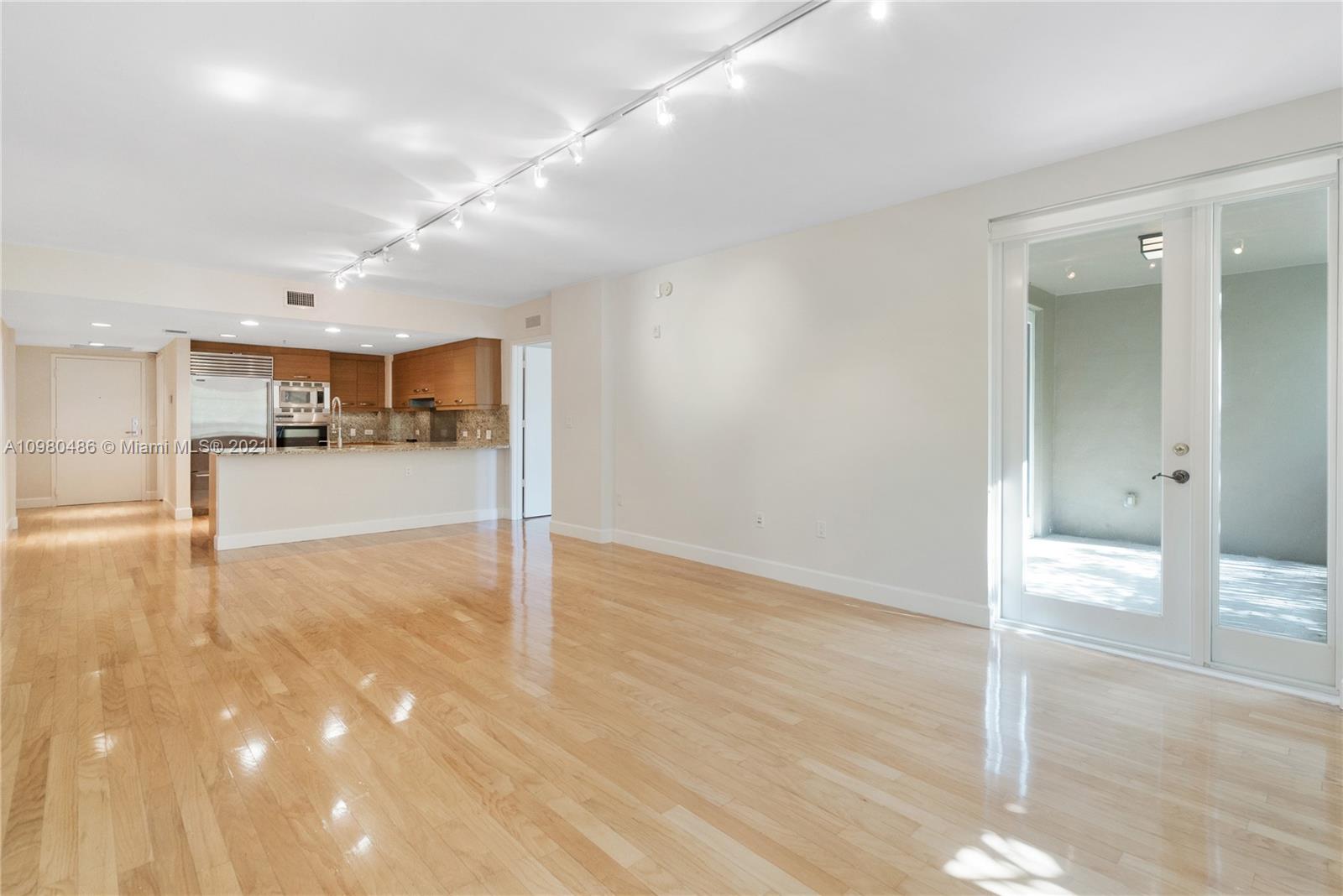 3540 Main Highway, Unit 309 Miami, FL 33133 - Photo 5 of 34 a view of a room with wooden floor