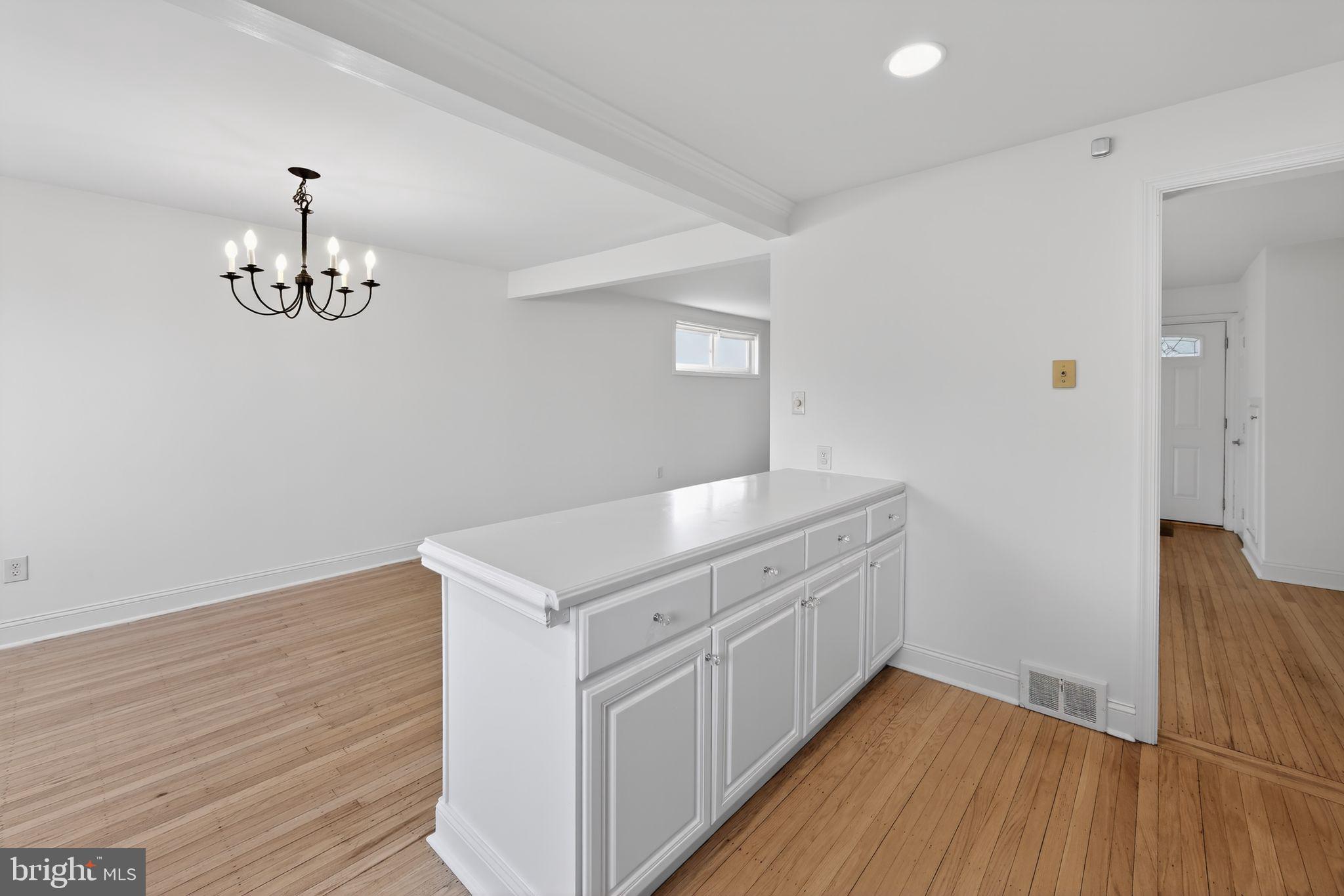 1567 Sugartown Road Paoli, PA 19301 - Photo 11 of 32 a kitchen with a sink and wooden floor