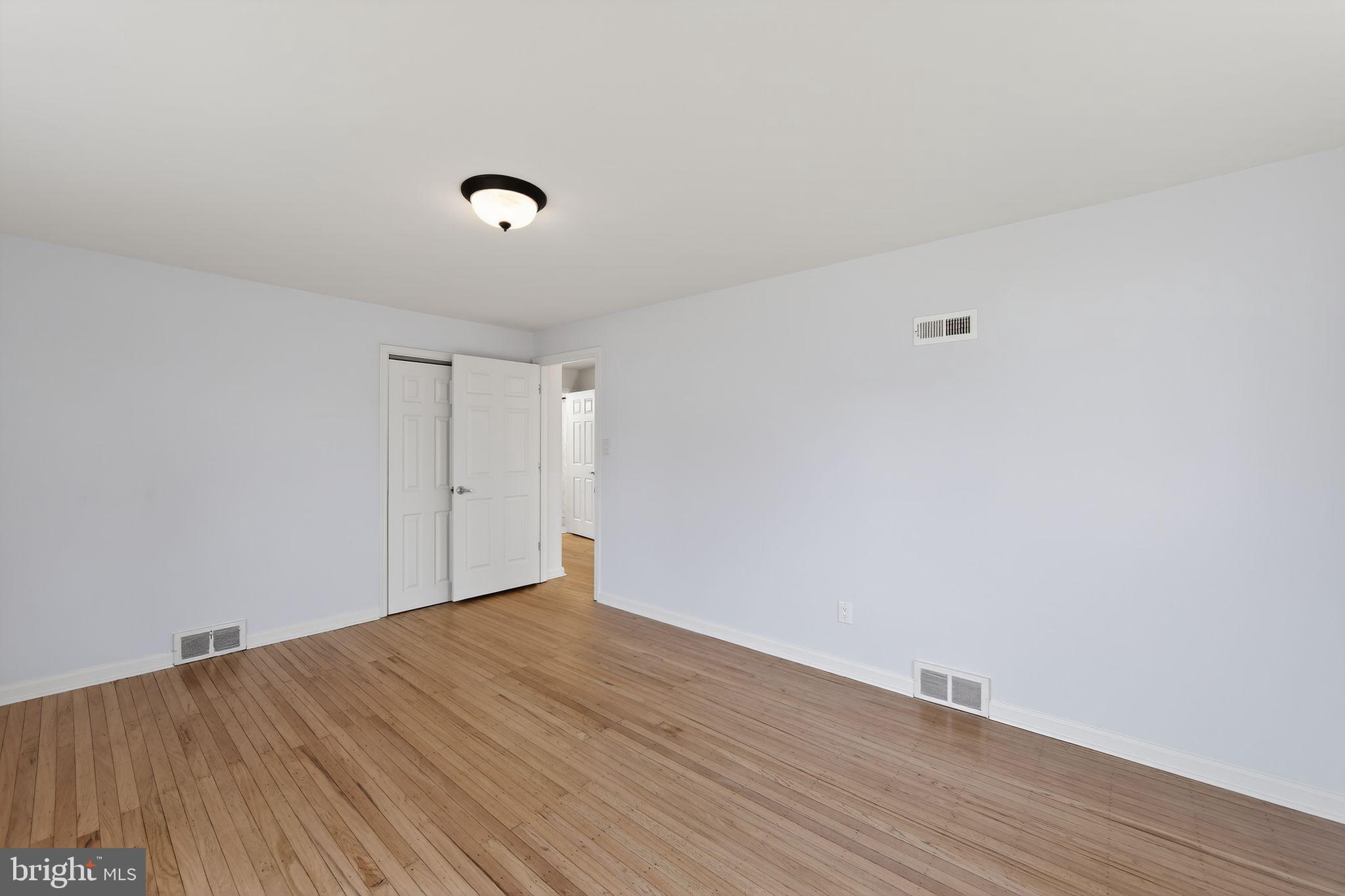 1567 Sugartown Road Paoli, PA 19301 - Photo 17 of 32 a view of an empty room with wooden floor