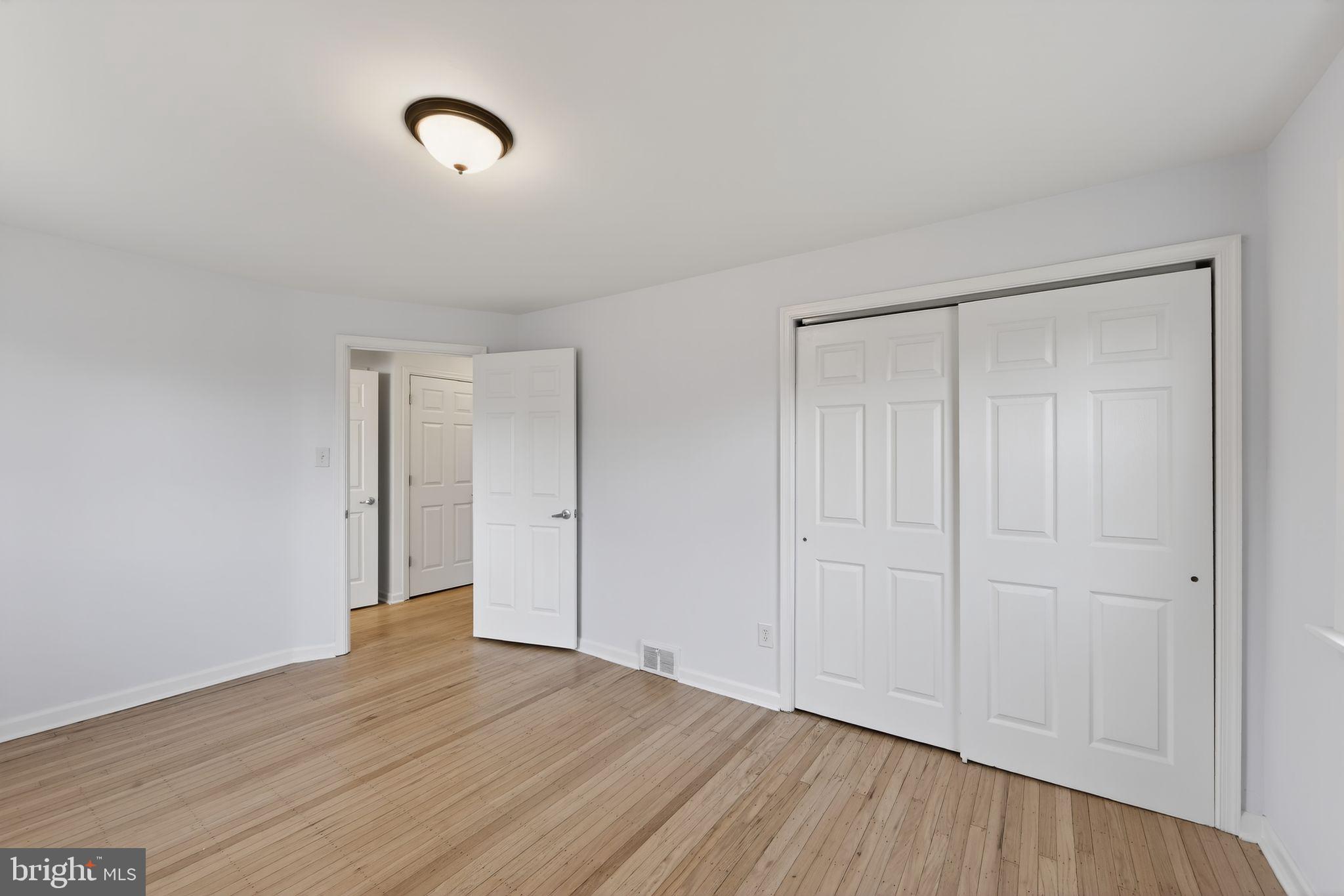 1567 Sugartown Road Paoli, PA 19301 - Photo 19 of 32 a view of an empty room with wooden floor