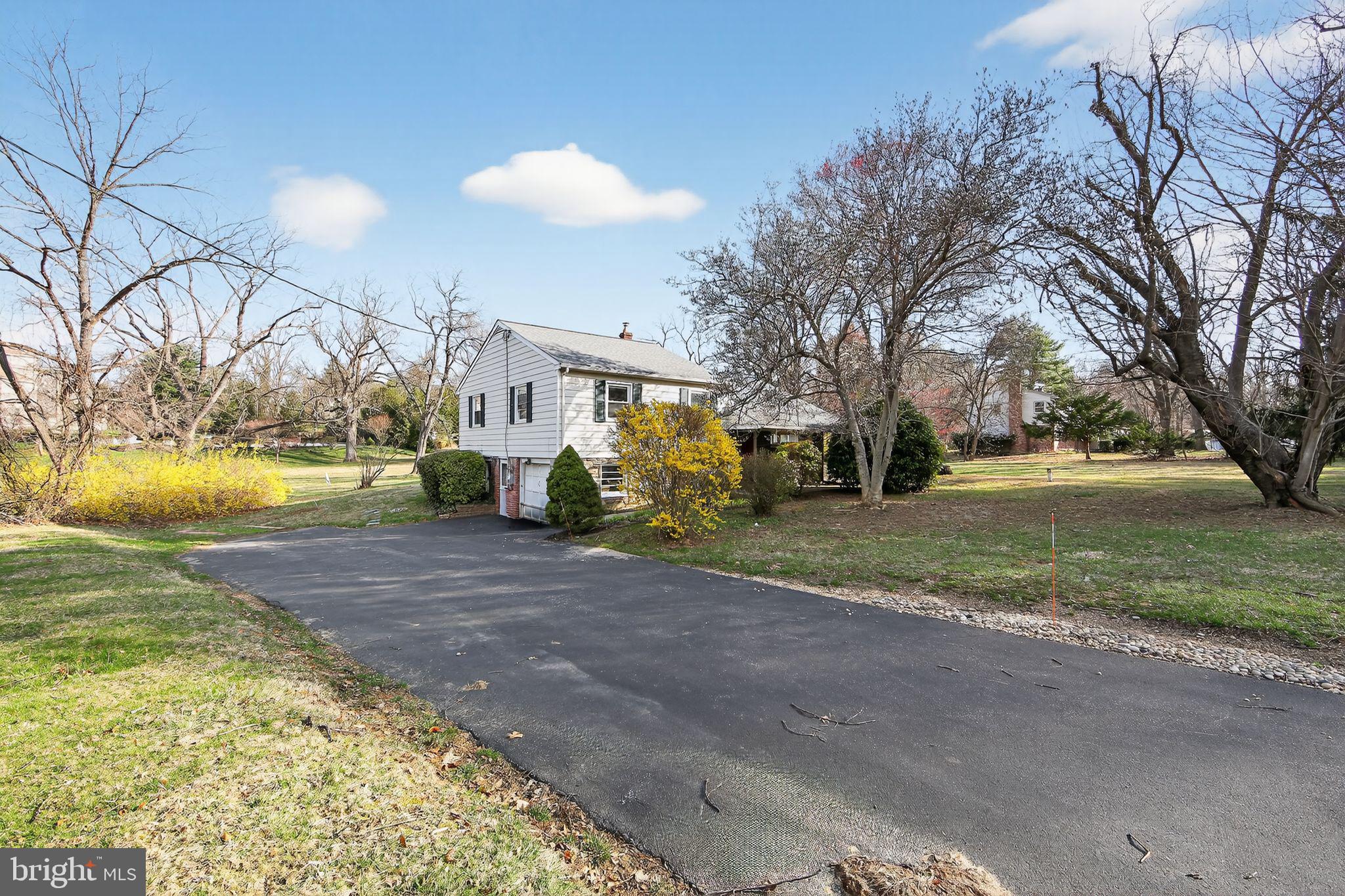 1567 Sugartown Road Paoli, PA 19301 - Photo 2 of 32 a view of a playground with basketball court