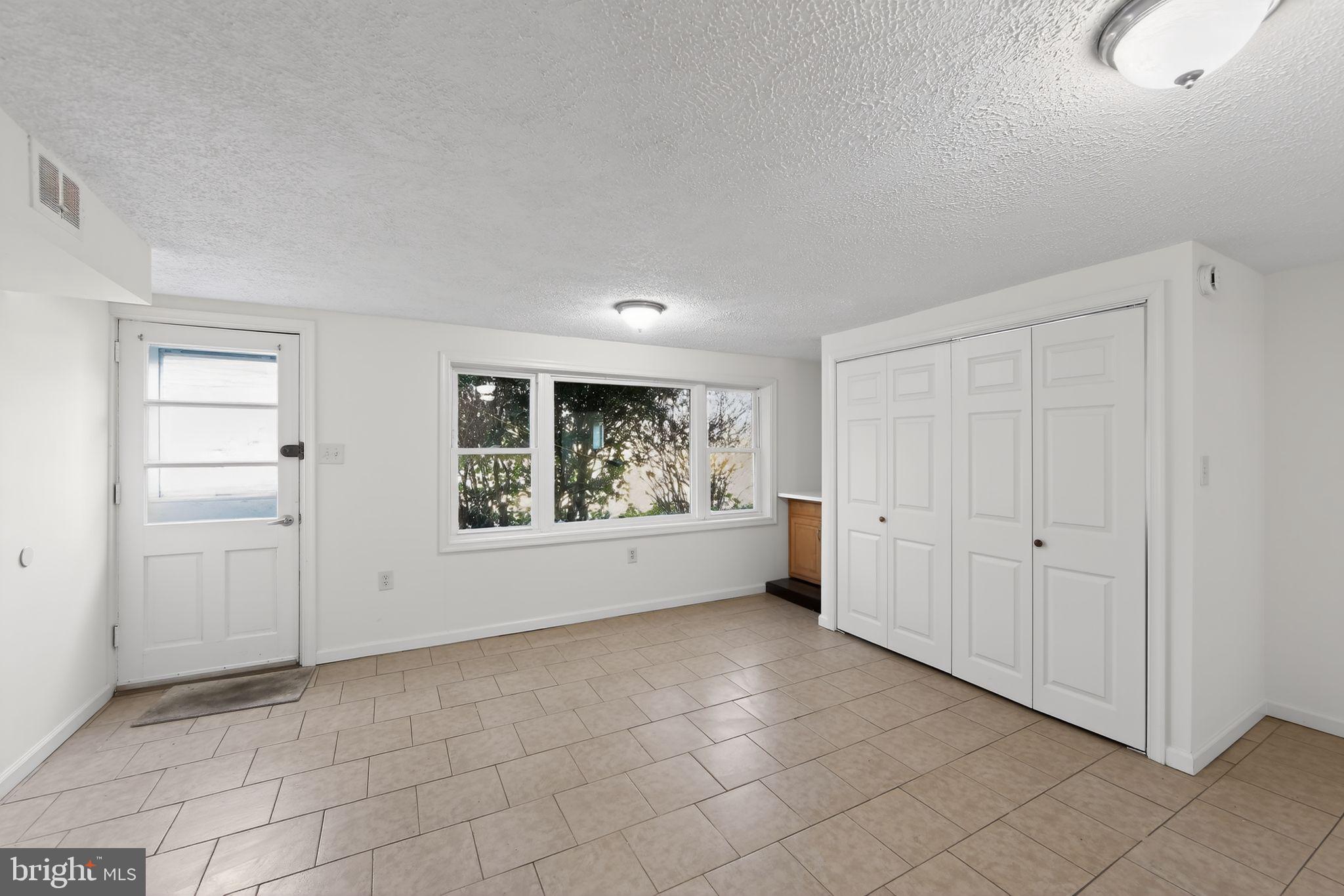 1567 Sugartown Road Paoli, PA 19301 - Photo 23 of 32 a view of an empty room with a window