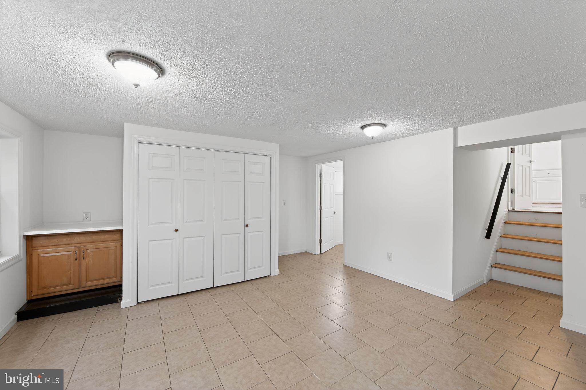 1567 Sugartown Road Paoli, PA 19301 - Photo 24 of 32 a view of an empty room and stairs