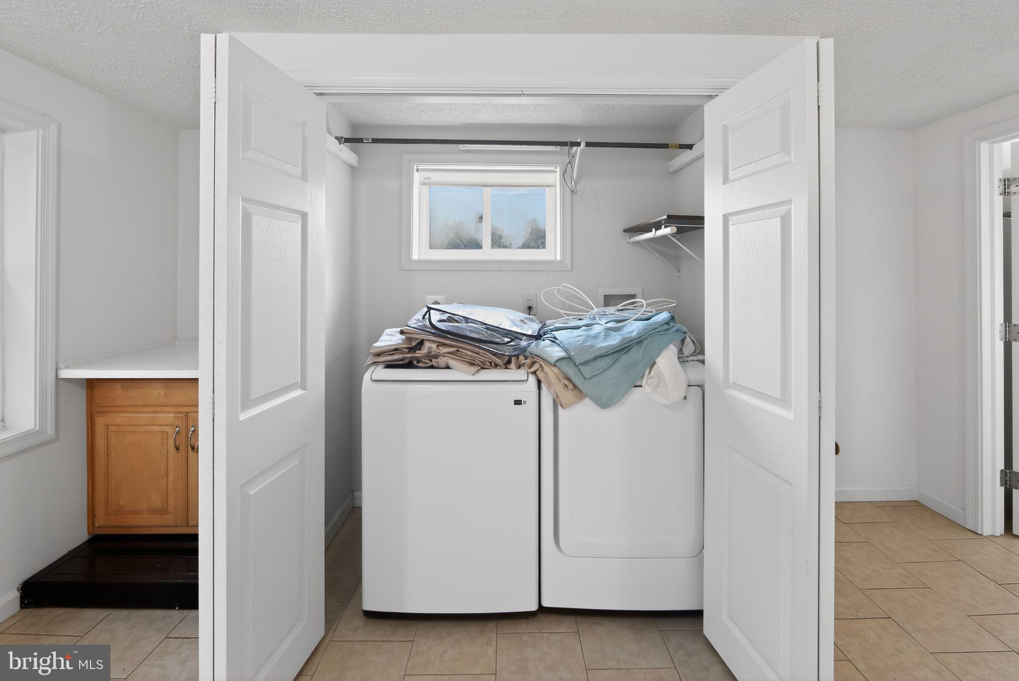1567 Sugartown Road Paoli, PA 19301 - Photo 26 of 32 a utility room with dryer and washer