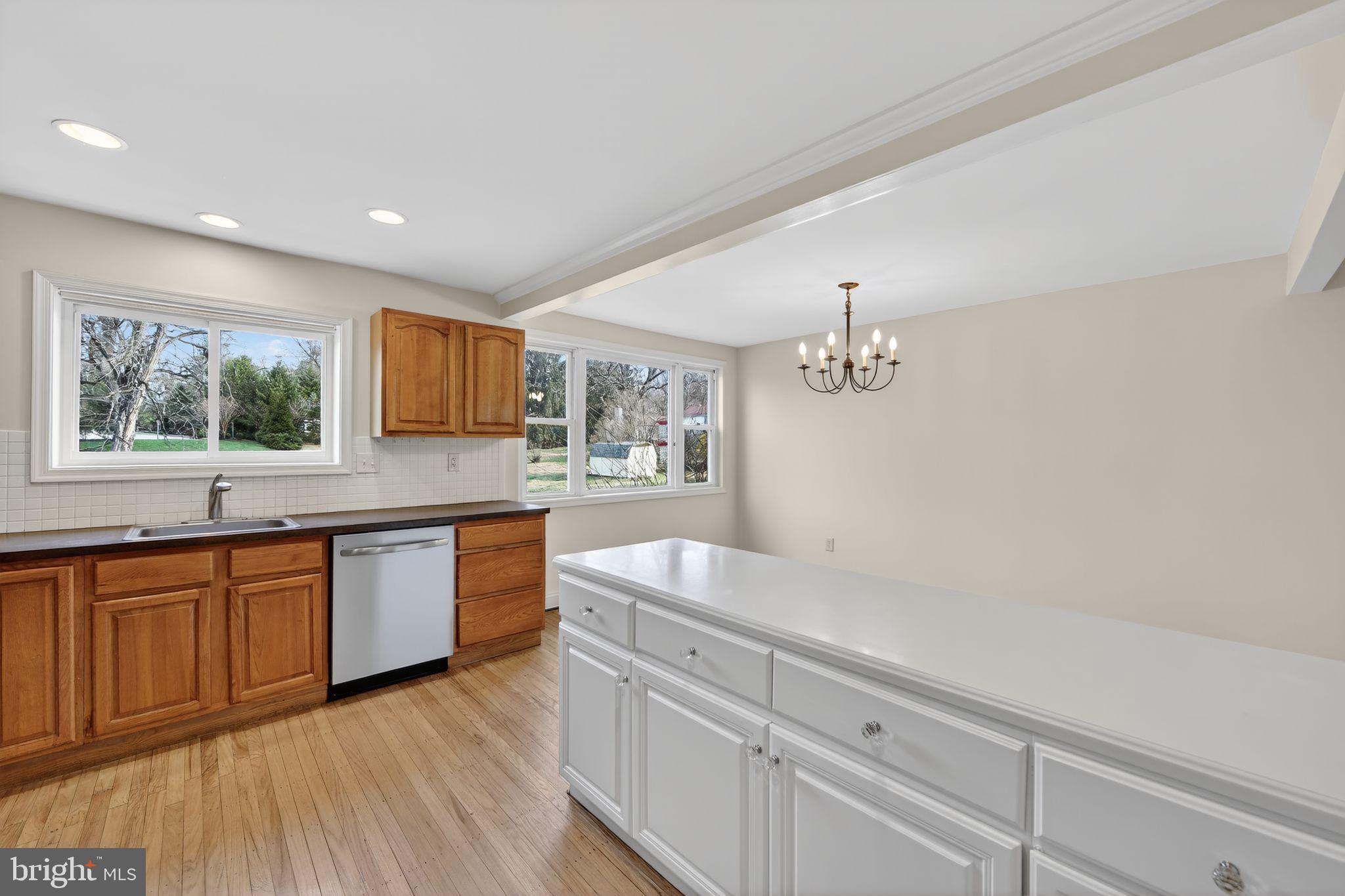 1567 Sugartown Road Paoli, PA 19301 - Photo 10 of 32 a spacious bathroom with a granite countertop sink and a large mirror