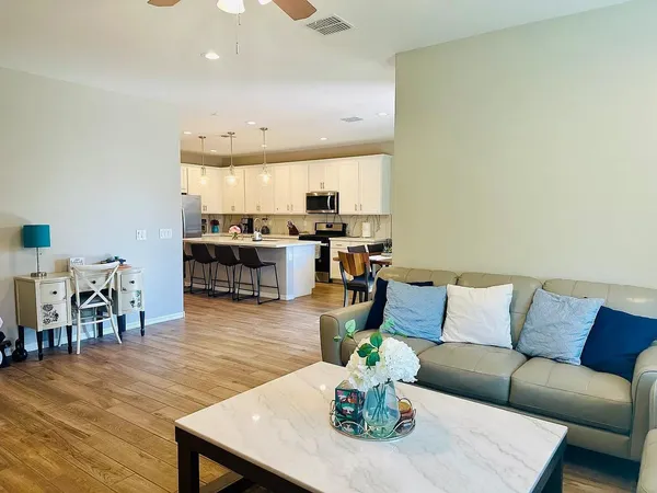 a kitchen with a sink and a refrigerator