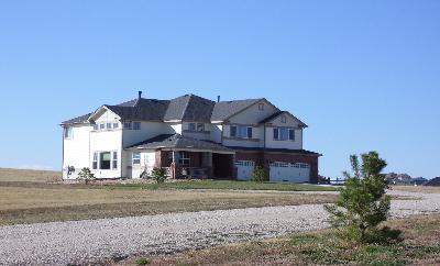 2413 Elkhorn Ranch Street Parker, CO 80138 - Photo 1 of 1 a front view of a house with a yard