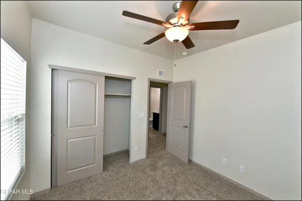 a view of a hallway with closet