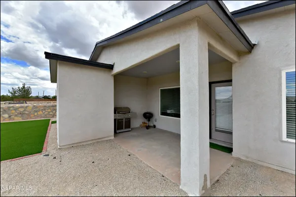 a view of a house with a yard and garage