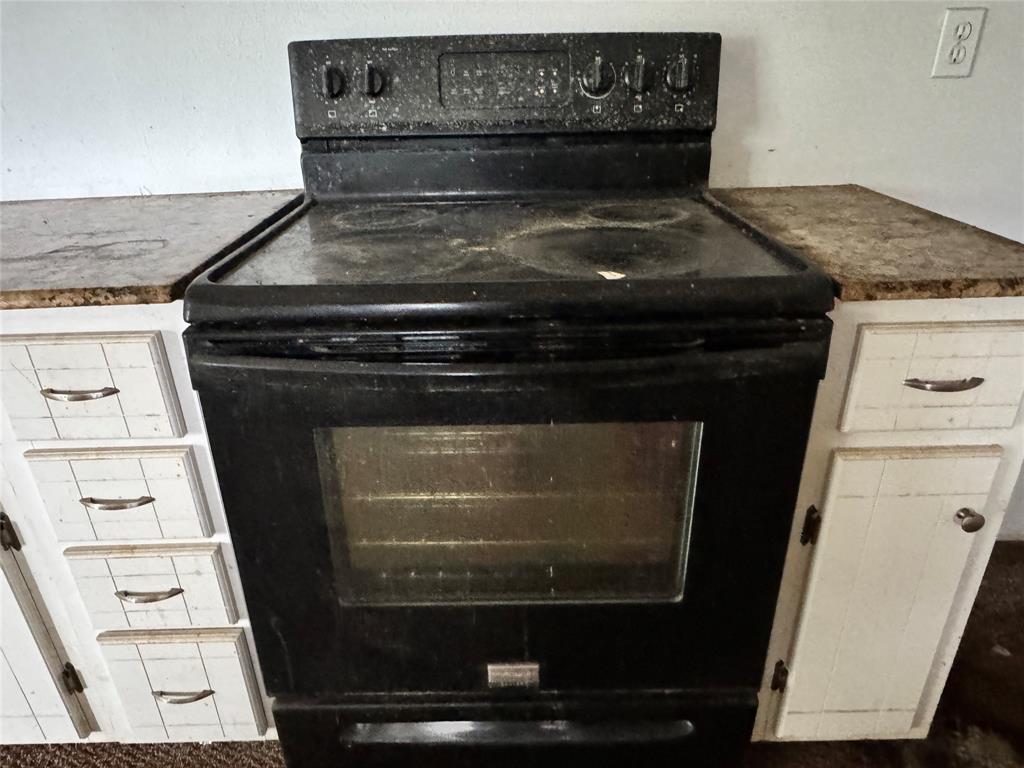 3909 Smothers Road Caney City, TX 75148 - Photo 18 of 35 a stove top oven sitting inside of a kitchen