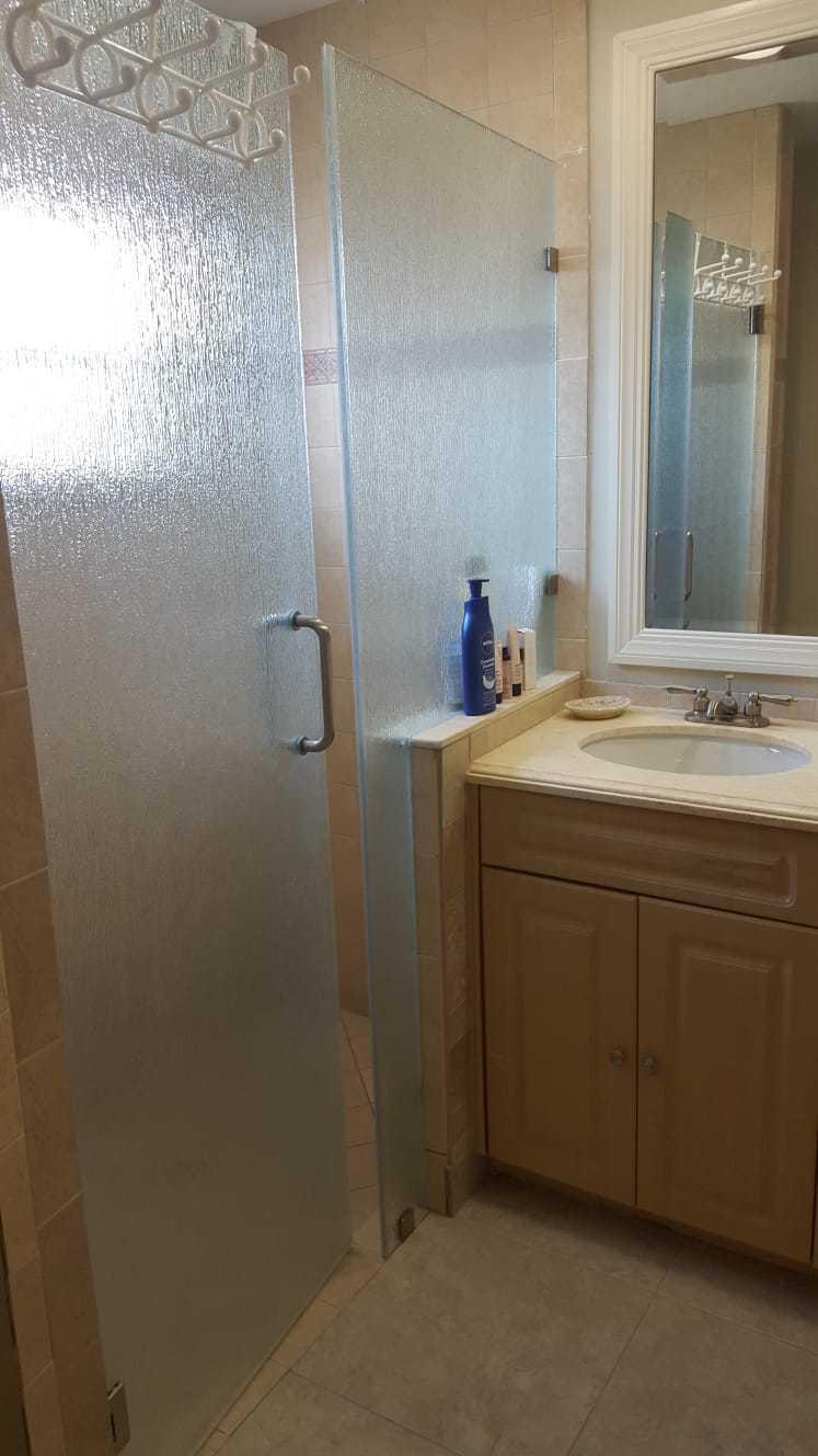 437 Kirk Road Palm Springs, FL 33461 - Photo 18 of 53 a bathroom with a sink and mirror