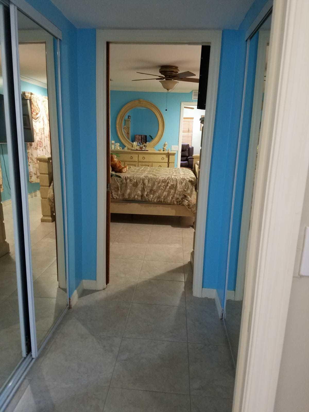437 Kirk Road Palm Springs, FL 33461 - Photo 22 of 53 a view of bedroom with mirror and window