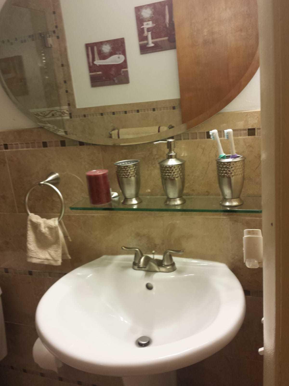 437 Kirk Road Palm Springs, FL 33461 - Photo 27 of 53 a bathroom with a sink and mirror