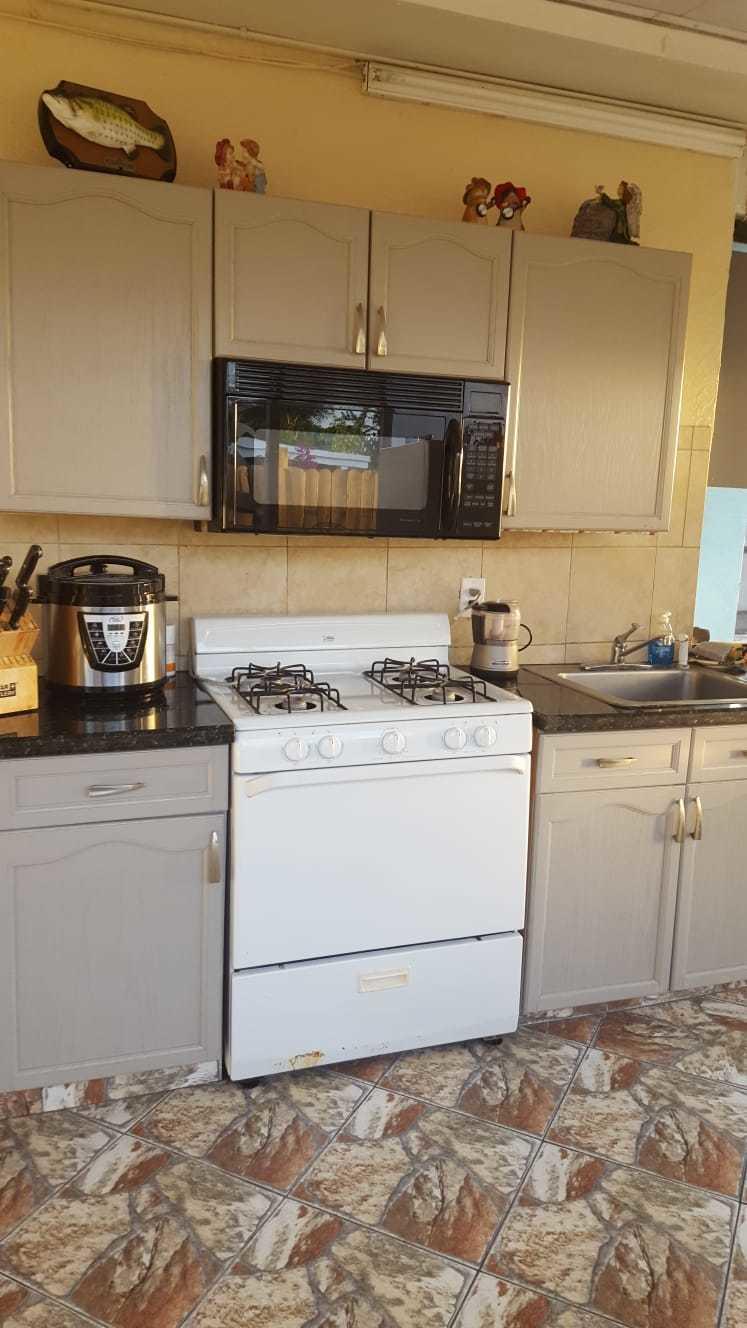 437 Kirk Road Palm Springs, FL 33461 - Photo 32 of 53 a utility room with a stove and a sink