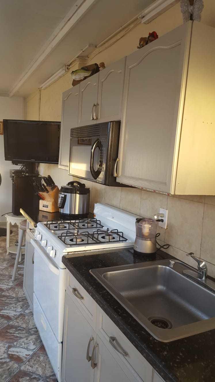 437 Kirk Road Palm Springs, FL 33461 - Photo 34 of 53 a kitchen with a stove and a sink
