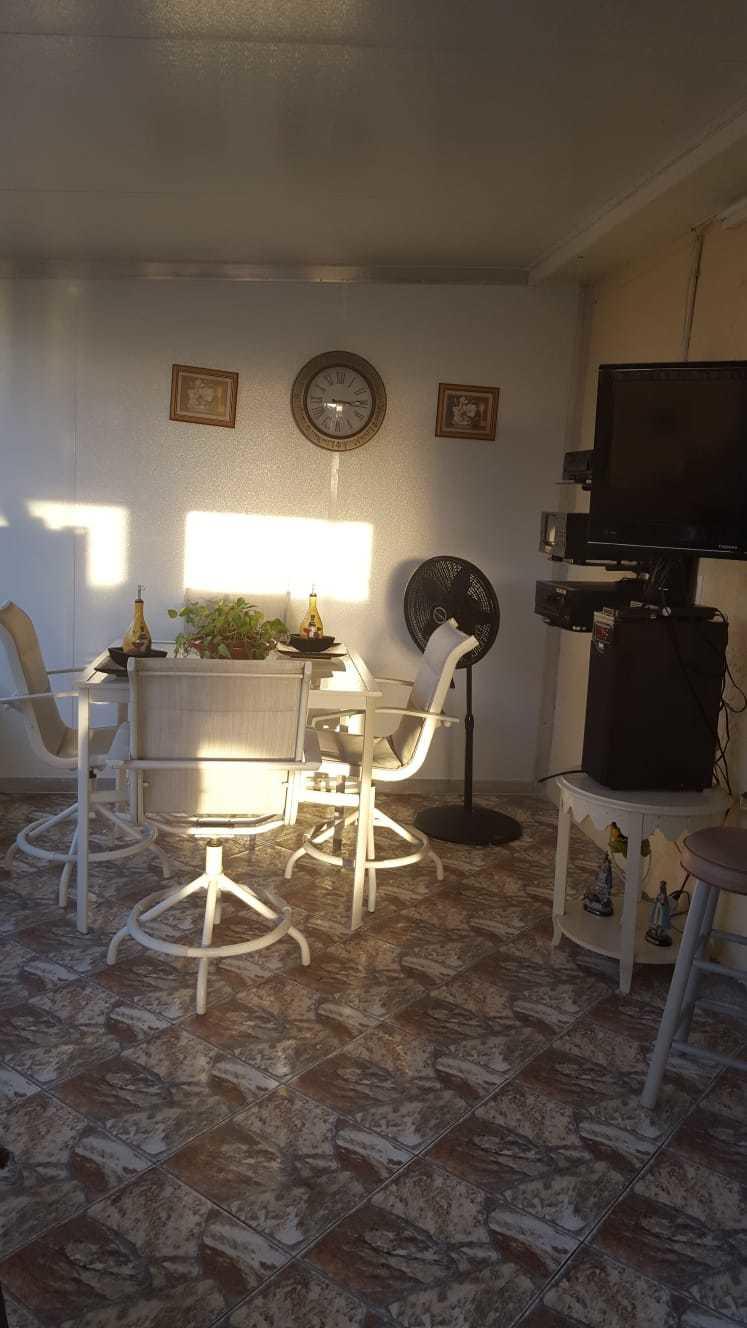 437 Kirk Road Palm Springs, FL 33461 - Photo 35 of 53 a room with furniture a flat screen tv and chairs