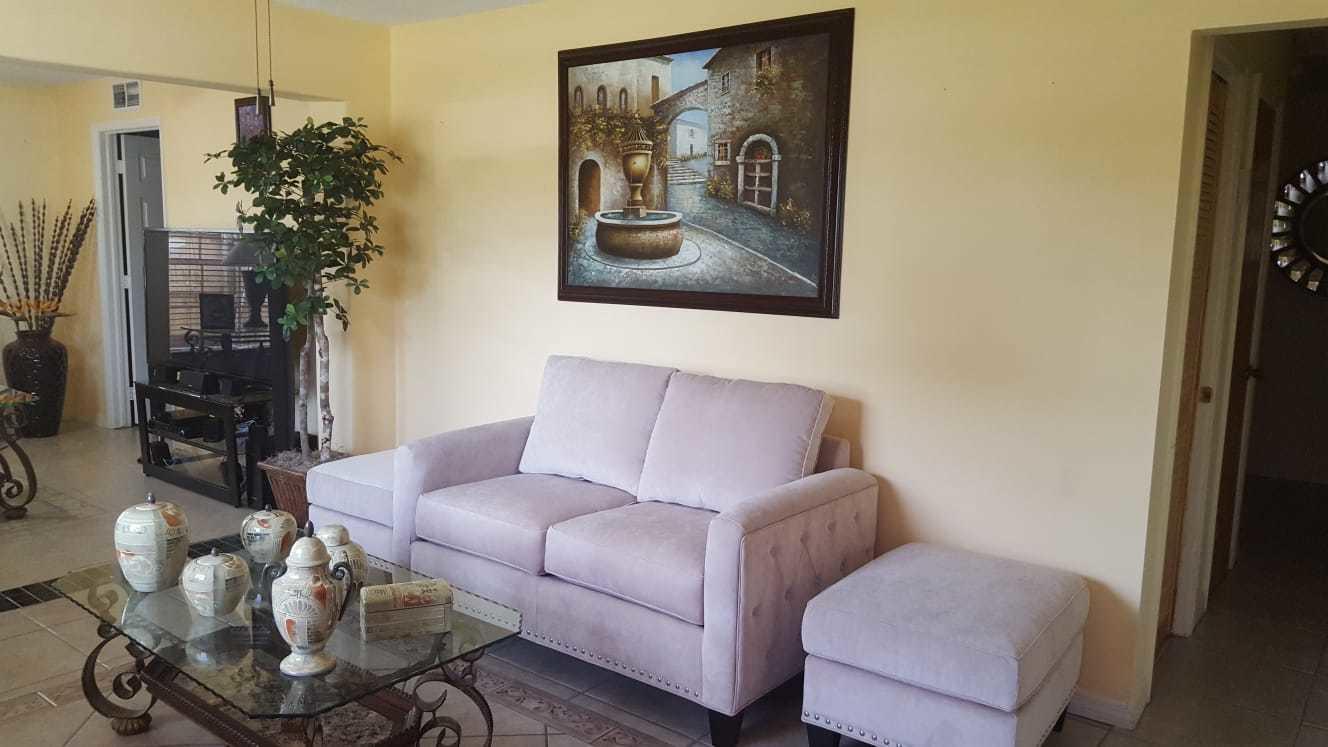 437 Kirk Road Palm Springs, FL 33461 - Photo 4 of 53 a living room with furniture and a potted plant